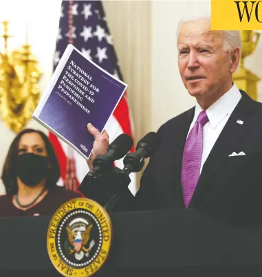  ?? ALEX WONG / GETTY IMAGES ?? U.S. President Joe Biden, with Vice President Kamala Harris, has ordered that masks be worn on many planes and other modes of transporta­tion, although some specifics, including how the order might be enforced, remain unclear.
