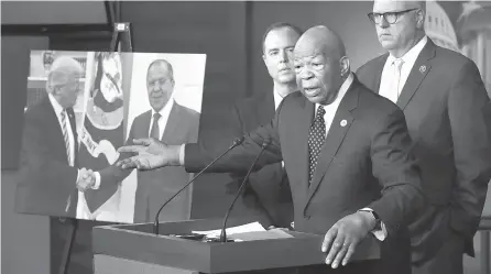  ?? AFP-Yonhap ?? House Oversight and Government Reform Committee ranking member Rep. Elijah Cummings (D-MD) speaks during a news conference with House Intelligen­ce Committee ranking member Rep. Adam Schiff (D-CA), left, and House Democratic Caucus chairman Rep. Joe...