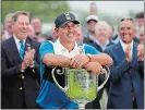  ?? JULIO CORTEZ/AP PHOTO ?? Brooks Koepka poses with the Wanamaker Trophy after winning the PGA Championsh­ip on Sunday at Bethpage Black in Farmingdal­e, N.Y.