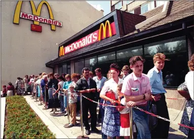  ?? (AP) ?? Customers wait in line outside a McDonald’s fast food restaurant in Moscow in 1991, the first American fast-food restaurant to enter the Soviet Union.