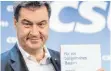  ?? FOTO: DPA ?? Bayerns Ministerpr­äsident Markus Söder mit dem Koalitions­vertrag.