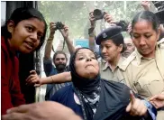  ?? — BIPLAB BANERJEE ?? Missing JNU student Najeeb Ahmed’s sister is detained during a protest near India Gate on Sunday.