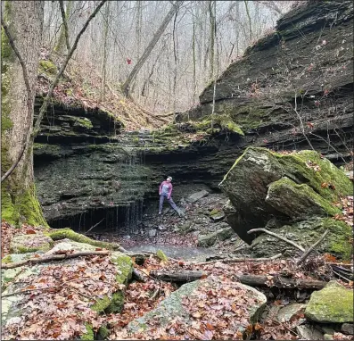  ?? ?? Dalene Ketcher plays with drip falls at a scenic site along a spur trail off the Ozark Highlands Trail.