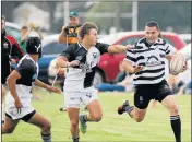  ?? Picture: FREDLIN ADRIAAN ?? ON THE RUN: Parks’ Morne van As, right, avoids Despatch’s Selwyn Davids, left, and JC Pittaway during their EP Grand Challenge match at Londt Park