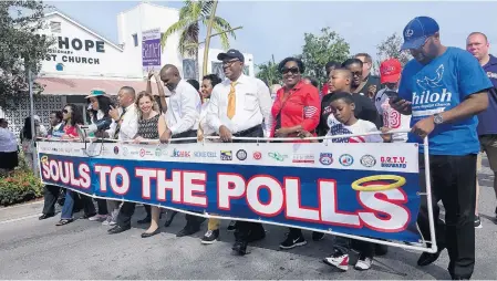  ?? JOE CAVARETTA/SUN SENTINEL ?? The “Souls to the Polls,” marchers, including U.S Rep. Debbie Wasserman Schultz, make thier way down Sistrunk Boulevard on Nov. 6, 2016, in Fort Lauderdale. The after-church event takes place last day of early voting in Florida.