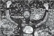  ?? Sean Gardner / Getty Images ?? Martin Truex Jr. celebrates after winning the NASCAR Cup Series race Saturday night.