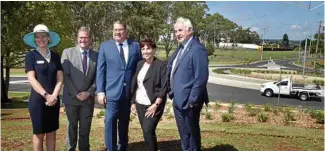  ?? Photo: Bev Lacey ?? NOW OPEN: At yesterday’s official opening of the Griffiths and Mort Sts upgrades are (from left) Department of Transport and Main Roads regional director Kym Murphy, Groom MP John McVeigh, Assistant Minister for Roads and Transport Scott Buchholz, deputy mayor Carol Taylor and mayor Paul Antonio.