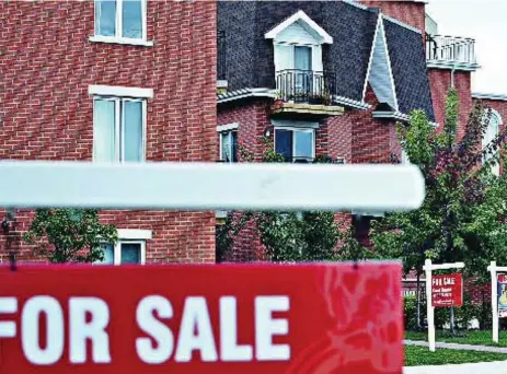  ?? AARON HARRIS/TORONTO STAR ?? Canada Mortgage and Housing Corp. says there is evidence of increasing­ly “problemati­c conditions” in more and more home markets across the country.