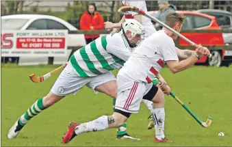  ?? All photograph: Iain Ferguson, alba.photos ?? Lochaber’s Gregor Cameron tries to parry an Andrew MacDonald goal attack.