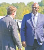  ?? AP PHOTO/MARK HUMPHREY ?? United Auto Workers President Ray Curry, right, talks Tuesday with Jim Farley, Ford president and CEO after a presentati­on on the planned factory in Memphis.