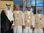  ??  ?? Prince Sultan bin Salman poses with some of the Saudi archaeolog­ists and assistants ahead of the opening of an exhibition on antiquitie­s at the National Museum in Riyadh.