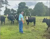  ??  ?? Tom Henry grew up raising cattle in southeast Kansas. He and his wife, Jamie, along with their children, raise a mixed breed of momma cows and calves on their farm in Guy.