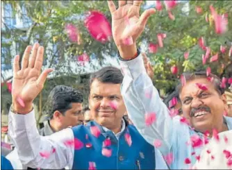  ?? KUNAL PATIL/HT FILE ?? Maharashtr­a chief minister Devendra Fadnavis celebrates the Bharatiya Janata Party’s performanc­e in the Brihanmumb­ai Municipal Corporatio­n polls in Mumbai, last month.