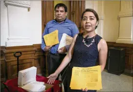  ?? JAY JANNER / AMERICAN-STATESMAN ?? Daniel Candelaria and Karla Perez, both DACA beneficiar­ies from Houston, arrive at the Capitol on Tuesday to deliver petitions and fictitious “newspapers” to representa­tives to show their opposition to SB4, the Sanctuary Cities bill.