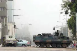  ??  ?? Military vehicles and soldiers patrol the streets in Harare yesterday.