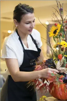  ??  ?? Floral designer Adrienn Eber of Floral Art Greystones, who shared her expertise at a floral demonstrat­ion at Flanagan Kerins, Bray Retail Park.