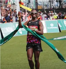  ??  ?? MAKING IT A HABIT: Bongumusa Mthembu became the first South African since 1988 to win back-to-back Comrades Marathon titles after clinching a gold medal in yesterday’s race from Pietermari­tzburg to Durban.