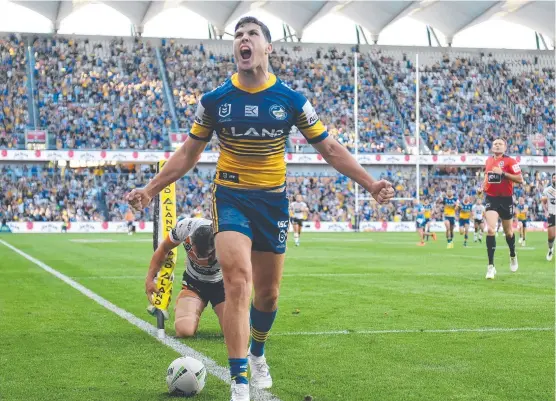  ?? Picture: AAP ?? SPANKING: Parramatta’s Mitchell Moses celebrates his opening try during yesterday’s flogging of Wests Tigers at the new Bankwest Stadium in Sydney.