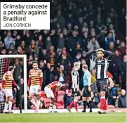  ?? JON CORKEN ?? Grimsby concede a penalty against Bradford