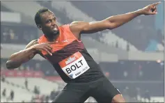  ?? — AFP photo ?? Usain Bolt creates his ‘Lightening Bolt’ pose as he celebrates winning the men’s 200m at the IAAF Diamond League Anniversar­y Games athletics meeting at the Queen Elizabeth Olympic Park stadium in Stratford, east London in this July 22, 2016 file photo.