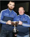  ??  ?? Danny Cooper and Billy O’Neill after Knocknagre­e’s brilliant win.