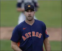  ?? JULIO CORTEZ - THE ASSOCIATED PRESS ?? Houston Astros pitcher Justin Verlander warms up prior to a spring training baseball game against the St. Louis Cardinals, Tuesday, March 3, 2020, in Jupiter, Fla.