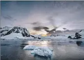  ?? Sebnem Coskun Anadolu Agency ?? ICE MELTS off Antarctica’s Horseshoe Island in February. The loss of ice accelerate­s global warming.