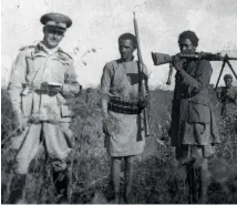  ??  ?? Left: An
Italian officer (left) and two Ethiopian irregulars (right), photograph­ed in Amhara during 1939