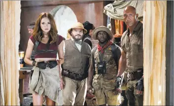  ?? SONY PICTURES ?? Karen Gillan, left, Jack Black, Kevin Hart and Dwayne Johnson in the comedy adventure “Jumanji: Welcome to the Jungle.”