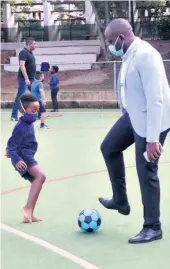  ??  ?? Yandiswa and Sizwe Zwane playing soccer