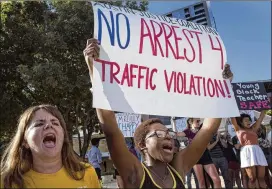  ?? RODOLFO GONZALEZ / AUSTIN AMERICAN-STATESMAN 2016 ?? Erin Walter (left) and Brianna Hardeman chant and hold posters during a Black Women Matter protest in August 2016 in front of City Hall in Austin. Video surfaced in 2016 showing an Austin police officer throwing Breaion King to the ground twice during a traffic stop for speeding.