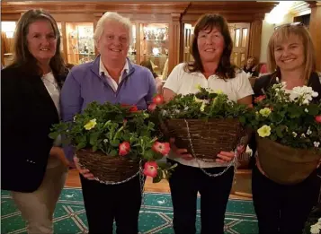  ??  ?? Mairéad Carty and Denise Kavanagh receiving first prize from Helen O’Connor in Courtown on Tuesday.