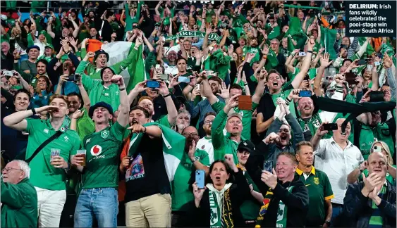  ?? ?? DELIRIUM: Irish fans wildly celebrated the pool-stage win over South Africa