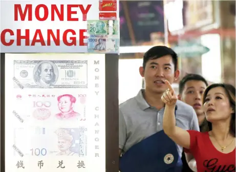  ??  ?? China's foreign exchange regulator said that the slight increase in reserves in June was driven by stronger non-dollar currencies against the greenback. (Reuters)