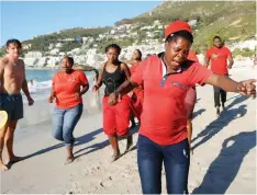  ?? AYANDA NDAMANE African News Agency (ANA) ?? EFF members protest at Clifton's Fourth beach over the alleged denial of access to visitors after sunset. The party, along with the City, will be taking action in response to the incidents.| YOLISA TSWANYA