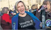  ??  ?? Labour MP Stella Creasy marks the centenary of enfranchis­ement, left, while University of London students recreate a march in Egham, right