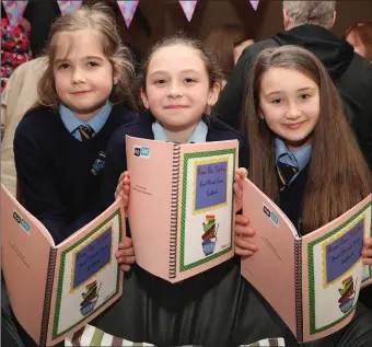  ??  ?? Pupils from Scoil Naomh Treasa in Bellewstow­n at the launch of their cookbook.