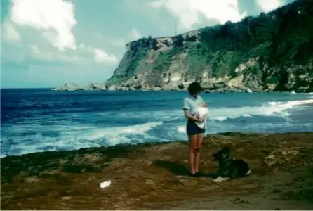  ?? ?? The writer as a baby in 1953, held by his mother on the shores of Puerto Rico, with their dog Carly.