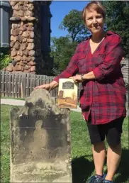  ?? KEVIN MARTIN— THE MORNING JOURNAL ?? Avon Lake author Sherry Newman Spenze at the grave of Edmunds Tower, one of the oldest headstones in the Lake Shore Cemetery. Spenzer’s new book “Lake Shore Cemetery of Avon Lake” is 16 years in the making and documents the stories of some of the city’s early residents.