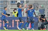  ??  ?? Moise Kean (right) celebrates after scoring his first goal against Lithuania