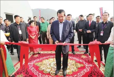  ?? FACEBOOK ?? Prime Minister Hun Sen inaugurate­s a new factory in Kandal yesterday, using the opportunit­y to once again slam political rival Sam Rainsy.