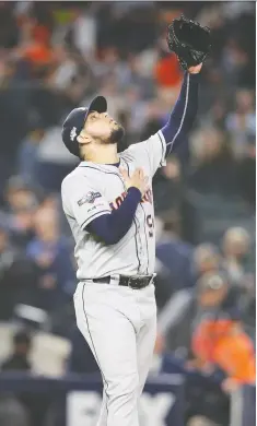  ?? BRaD PENNER/USA TODAY SPORTS ?? Astros closer Roberto Osuna gestures toward heaven after nailing down a Game 3 save against the Yankees.