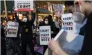  ?? Photograph: Chris McGrath/Getty Images ?? People dance and hold signs during a protest in support of counting all votes in Philadelph­ia, Pennsylvan­ia, on 5 November.