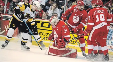  ?? BRIAN KELLY THE SAULT STAR ?? Greyhounds goaltender Matthew Villalta had plenty of teammates backing him up during Game 2 of the OHL final series Saturday night in Sault Ste. Marie. The Greyhounds hung on to tie the series heading to Hamilton on Monday night.