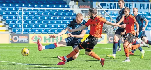  ??  ?? Dundee United striker Nicky Clark fires home the winning goal in the 79th minute