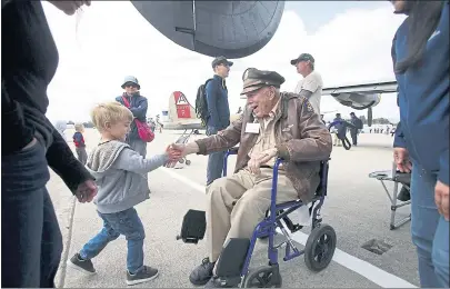  ?? PHOTOS BY KARL MONDON — STAFF PHOTOGRAPH­ER ?? World War II veteran Dave Campbell, 95, greets visitors at the Wings of Freedom Tour during its stop at Moffett Field.