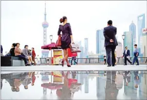  ?? PHILIPPE LOPEZ/AFP ?? The skyline of Shanghai’s Lujiazui financial district. By 2030, the Chinese consumer market will be equal to Western Europe and the US combined.