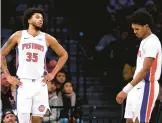  ?? NOAH K. MURRAY/AP ?? The Pistons’ Marvin Bagley III, left, and Ausar Thompson look on during a game against the Nets on Saturday in Brooklyn.