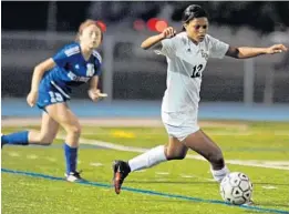  ?? GARY CURRERI/CORRESPOND­ENT ?? Junior forward Dayana Martin controls the ball during Boca Raton’s match against Wellington. She scored twice to bring her season total to 23.