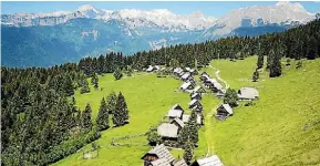  ?? ISTOCK ?? An alpine village set against the mountainou­s backdrop.